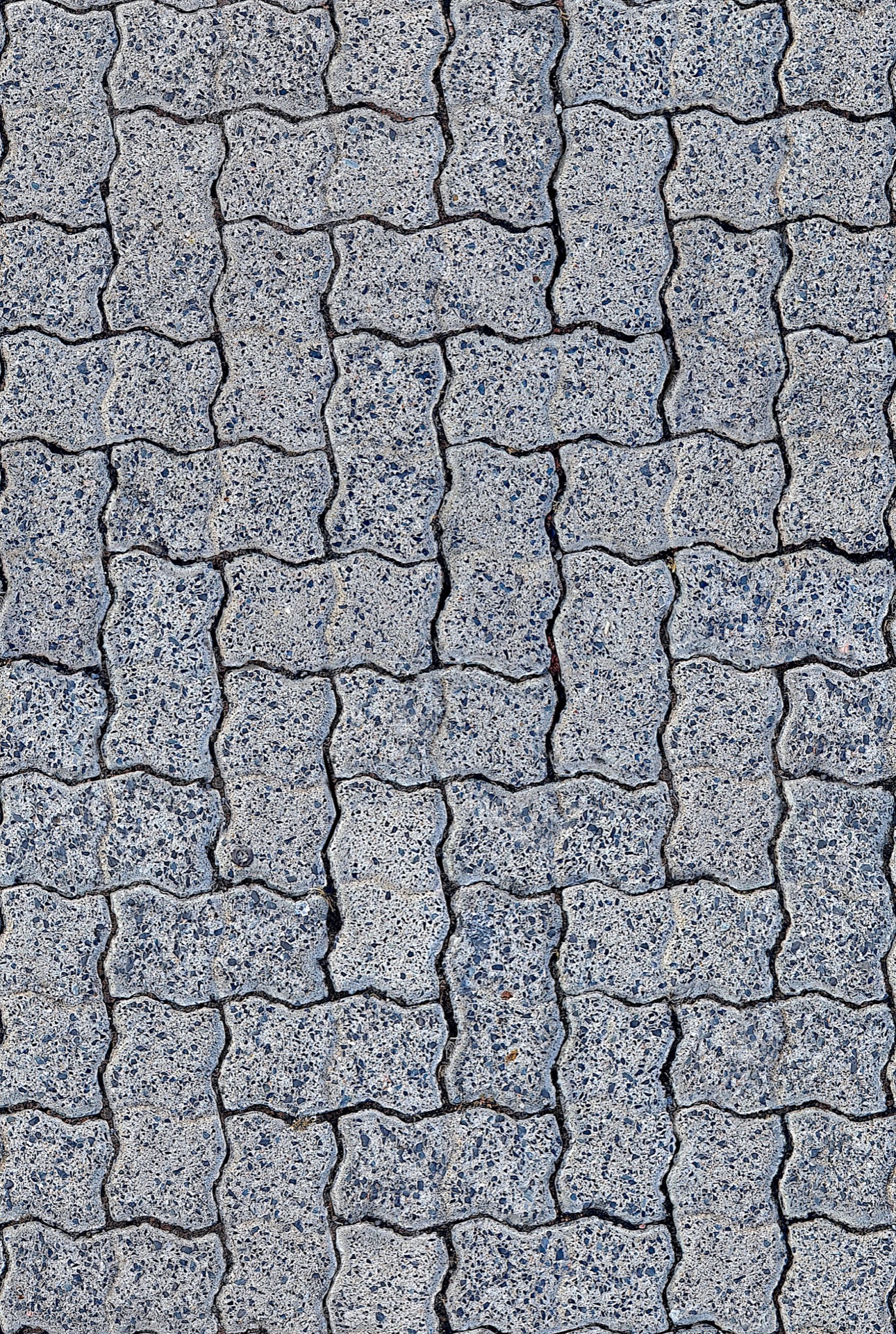 Top down view of interlocking permeable pavers filling the frame